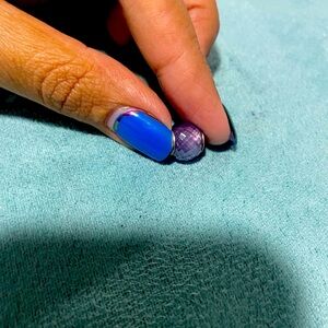 Abstract silver charm with faceted opalescent lilac crystal